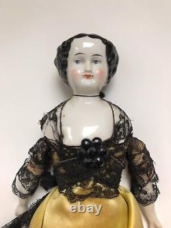 A Victorian/Edwardian Porcelain Dressed Doll