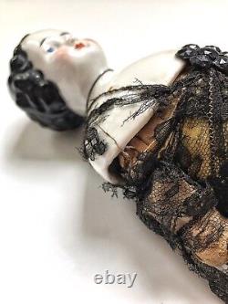 A Victorian/Edwardian Porcelain Dressed Doll