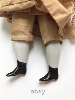 A Victorian/Edwardian Porcelain Dressed Doll