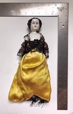 A Victorian/Edwardian Porcelain Dressed Doll