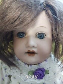 Antique Bisque doll AM Dressed