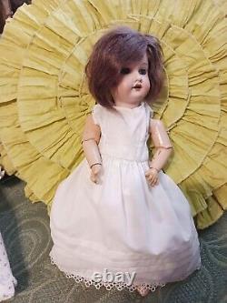 Antique Bisque doll AM Dressed