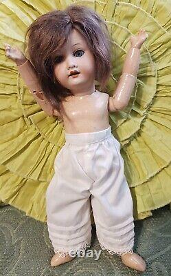 Antique Bisque doll AM Dressed