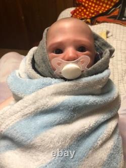 Hand painted vinyl reborn baby boy in perfect condition