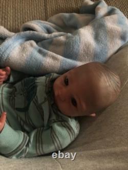 Hand painted vinyl reborn baby boy in perfect condition