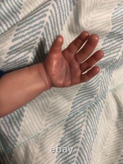 Hand painted vinyl reborn baby boy in perfect condition