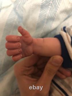 Hand painted vinyl reborn baby boy in perfect condition