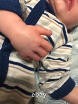 Hand painted vinyl reborn baby boy in perfect condition