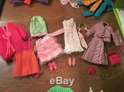 Vintage Barbie and Francie dolls in case with 12 Outfits